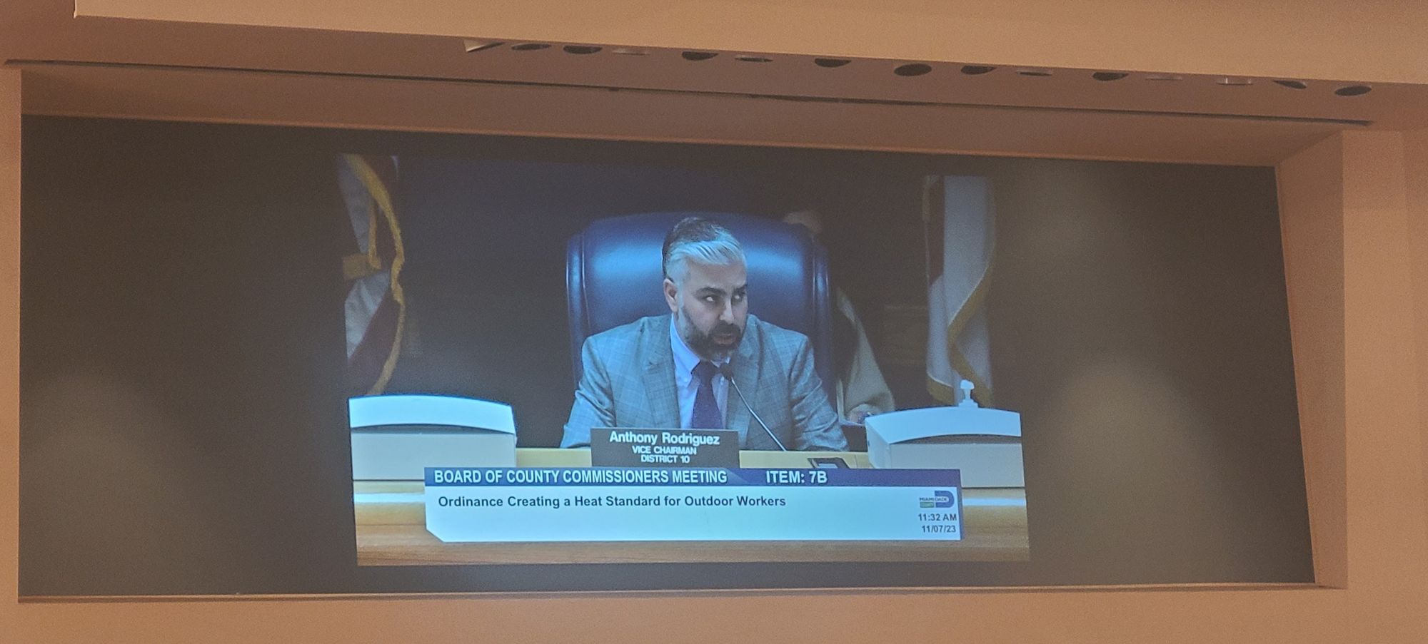 Photo of Vice Chair Anothony Rodriguez on the chamber video screen talking about the Miami Dade Heat Ordinance