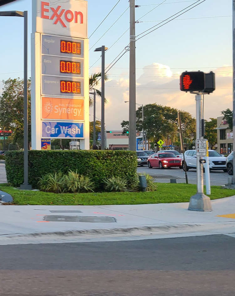 The sign board for a gas station has "$0.00" listed for every gas price.